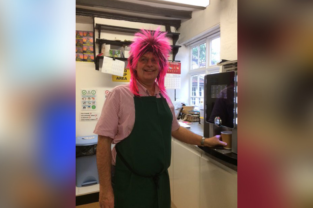 Staff wearing pink wigs in support of Breast Cancer Research