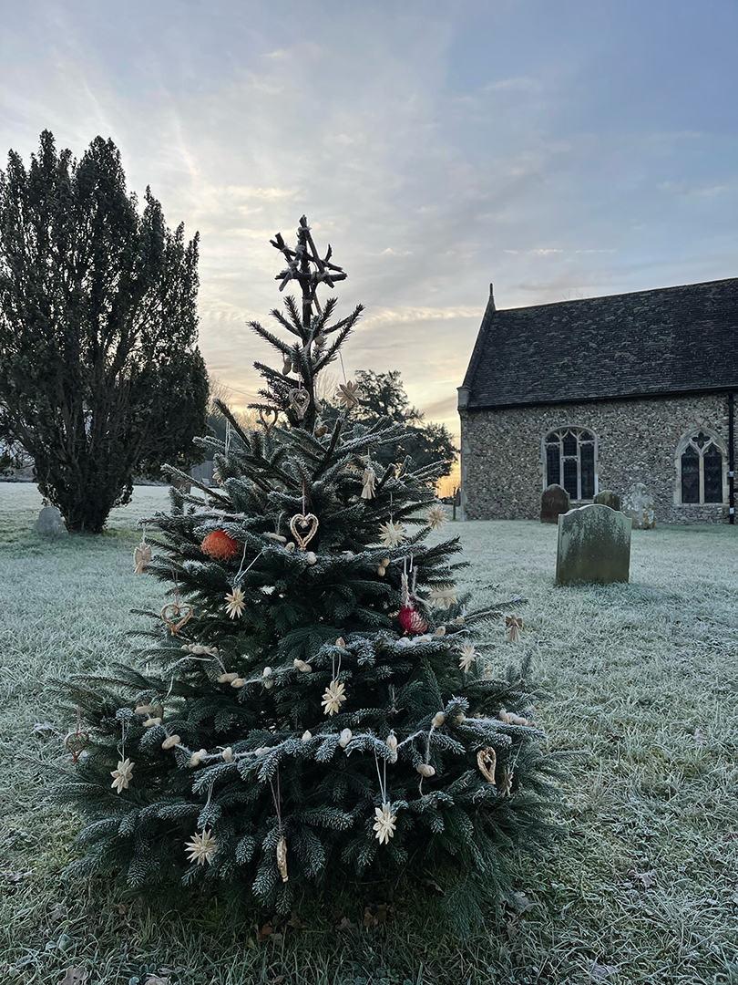 St Mary's Church Coddenham with Christmas tree in frost